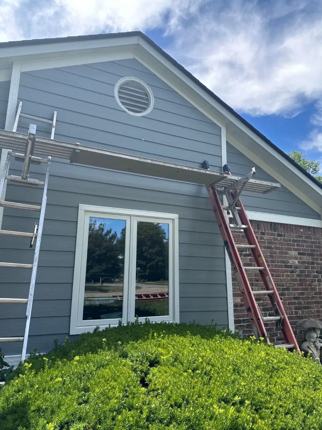 Siding installation documented in Glen Oaks Commons